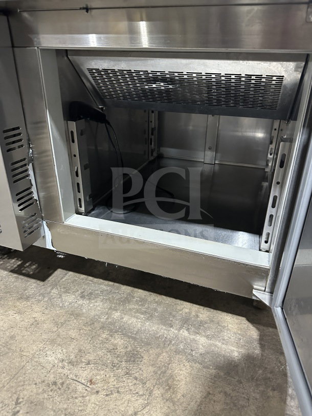 VEVOR stainless steel electric blast chiller, countertop model, 110/115V, on casters, interior view showing shelving and plug.