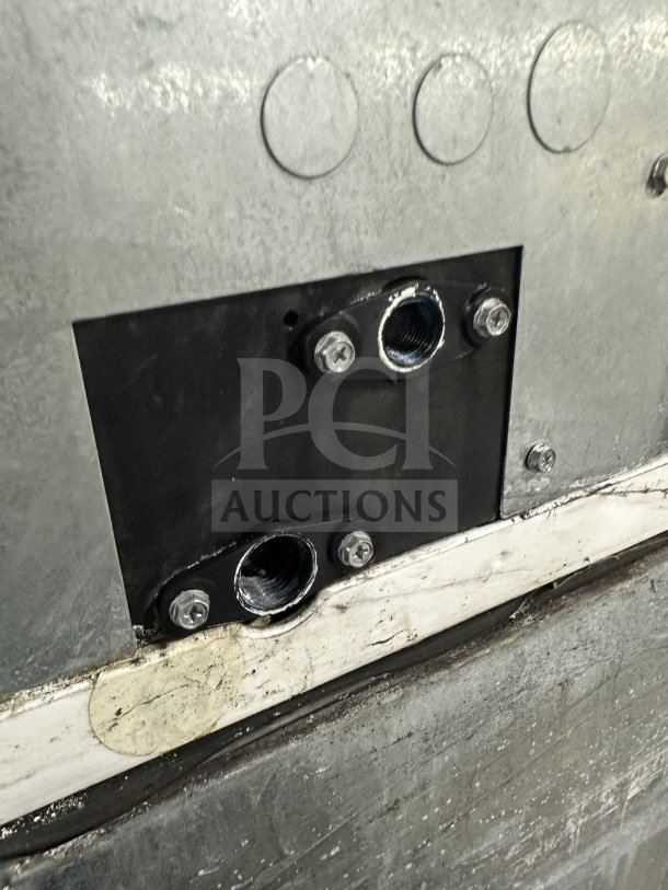 Close-up view of Manitowoc Indigo NXT Series ice machine connection points, model IY1106A-261, in stainless steel.