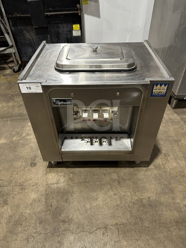 Taylor 16227 stainless steel soft serve ice cream machine, countertop model. Great condition with visible brand tags.
