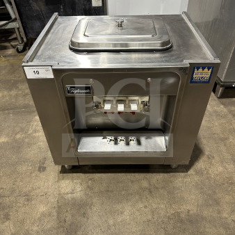Taylor 16227 stainless steel soft serve ice cream machine, countertop model. Great condition with visible brand tags.