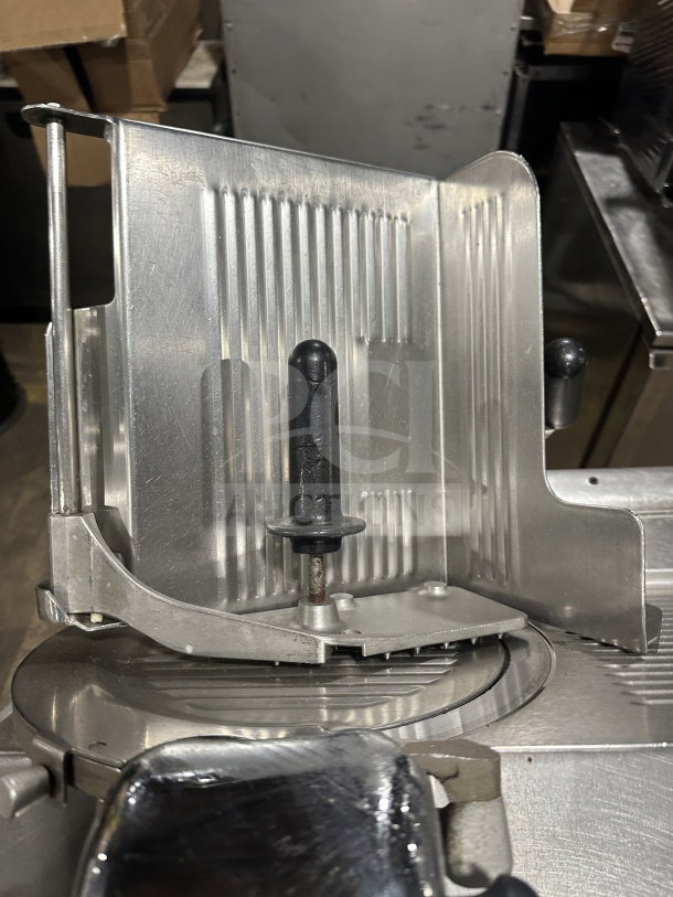 Chefmate Globe Series electric deli meat slicer, countertop model with manual gravity feed, stainless steel, on legs, used condition.