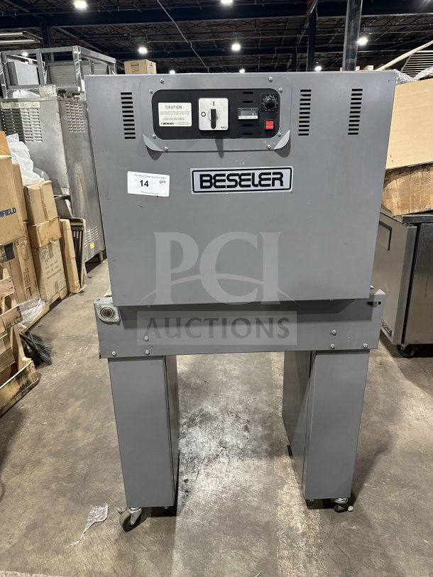 Beseler TD-16-10 shrink wrap system, 220V, 1 phase, on casters. Features control panel, marked with model info and warning label.