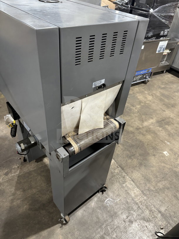 Beseler TD-16-10 shrink wrap system, electric-powered, on casters, 220V, 1 phase. Model: 061300154. Industrial condition.