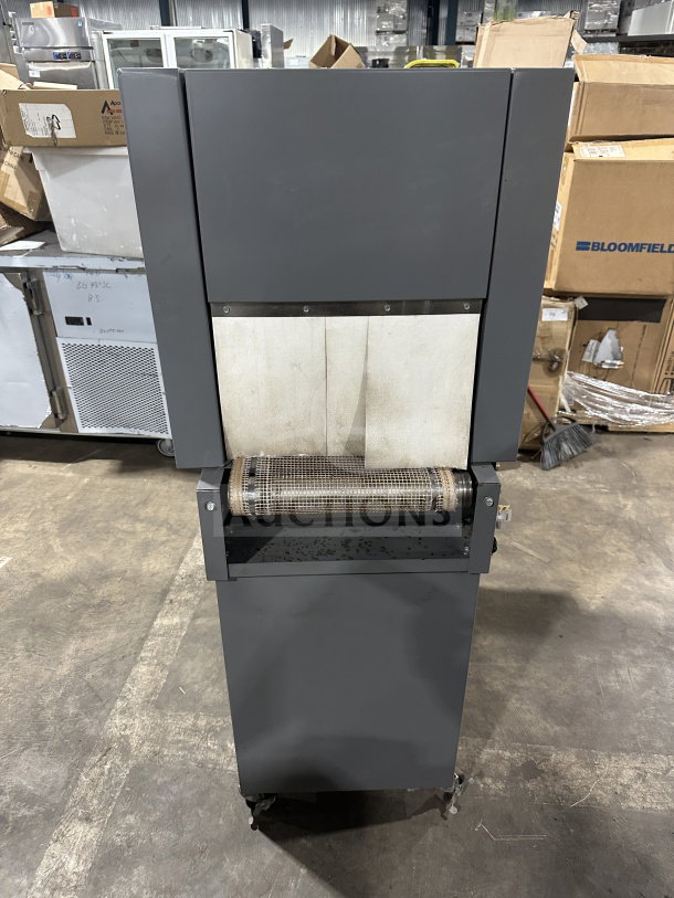 Beseler TD-16-10 shrink wrap system with heat tunnel, 220V, 1-phase, on casters. Serial No: 061300154. Good condition.