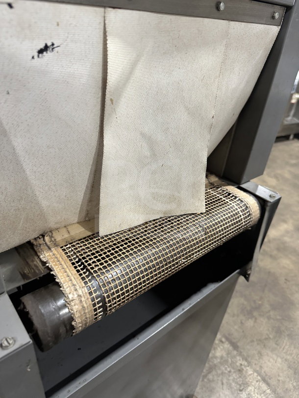 Beseler TD-16-10 electric shrink wrap system, 220V, 1 phase, on casters. Shows conveyor section texture and detail.