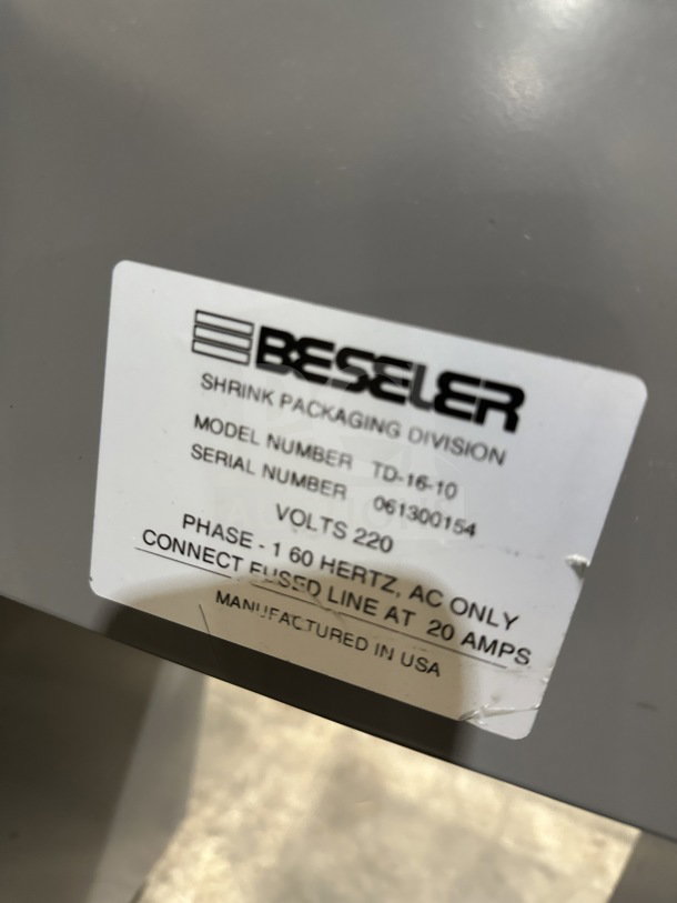 Beseler TD-16-10 shrink wrap system label, serial 061300154, 220V, 1 Phase, on casters, manufactured in USA.