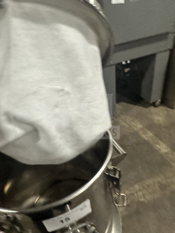 Commercial stainless steel pneumatic pressure pot dispensing tank, gas powered, heavy-duty, on casters, in good condition.