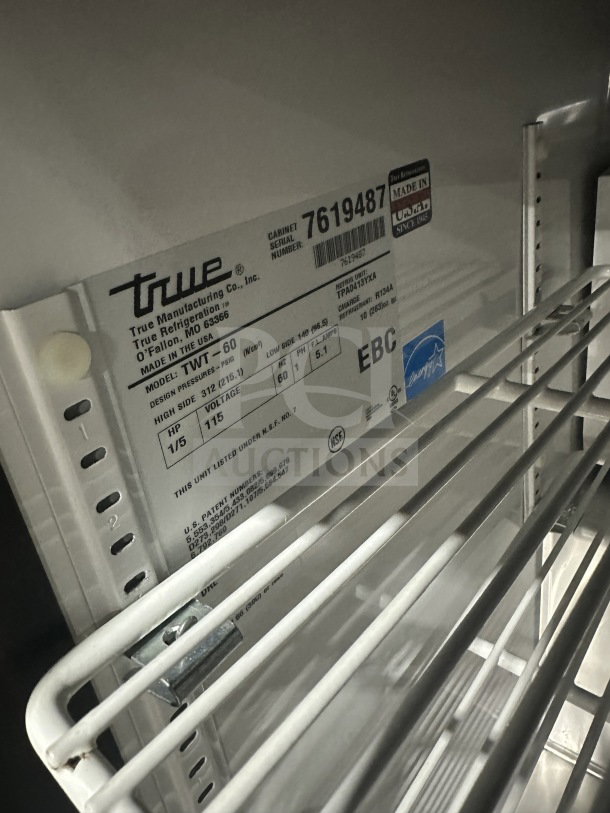 True TWT-60 2-Door Stainless Steel Refrigerated Worktop Table, Energy Star Certified, with Poly Coated Wired Rack, Serial 7619487.