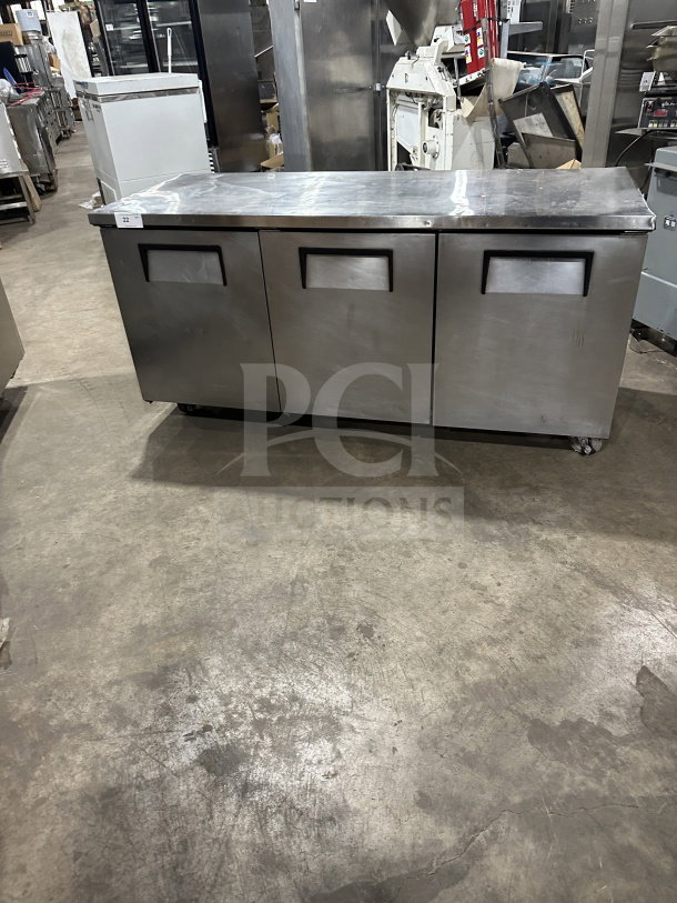 True TUC-72 stainless steel 3-door undercounter refrigerator on casters, poly coated wired rack, Energy Star-rated, used condition.
