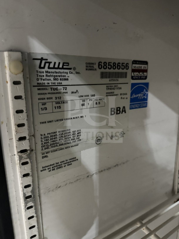 True TUC-72 commercial stainless steel 3-door undercounter refrigerator with Energy Star rating, model label visible.