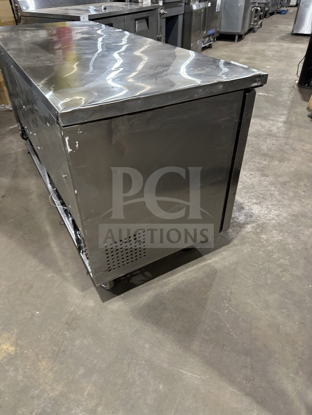 True TUC-72 stainless steel 3-door undercounter refrigerator, with poly coated rack, Energy Star, 115V, on casters.