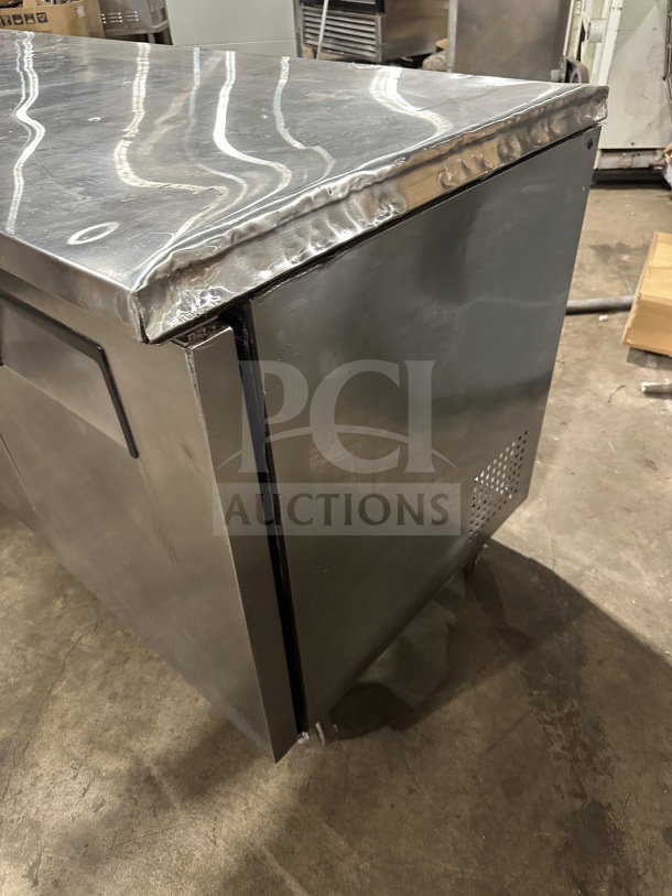True Commercial Stainless Steel 3-Door Undercounter Worktop Refrigerator, Model TUC-72, on casters, energy-efficient.