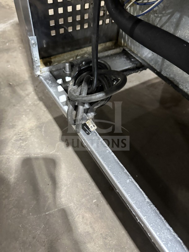 True Commercial Stainless Steel 3-Door Undercounter Refrigerator, Model TUC-72, with casters and poly-coated wired rack.