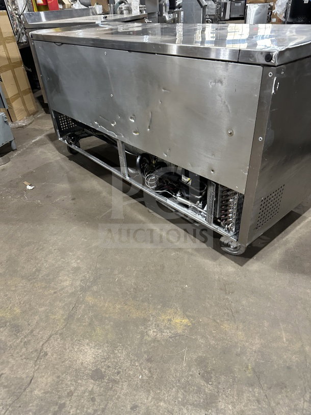 True TUC-72 stainless steel 3-door undercounter refrigerator with poly-coated wire racks and casters. Energy Star certified.
