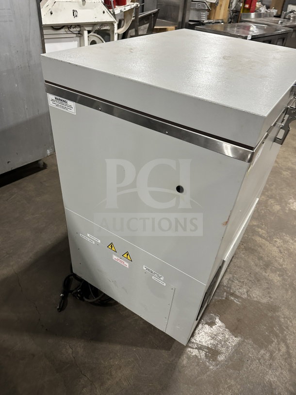 So-Low CA55 commercial chest freezer in white. Features low temperature capability. Model: CA5-5, SN: 202141693, 115V.