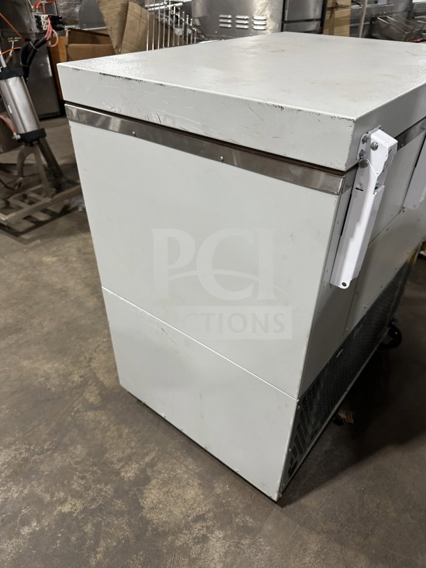 So-Low Commercial Series white chest freezer, Model CA55, shows minor surface wear, 115V power, stainless steel trim.