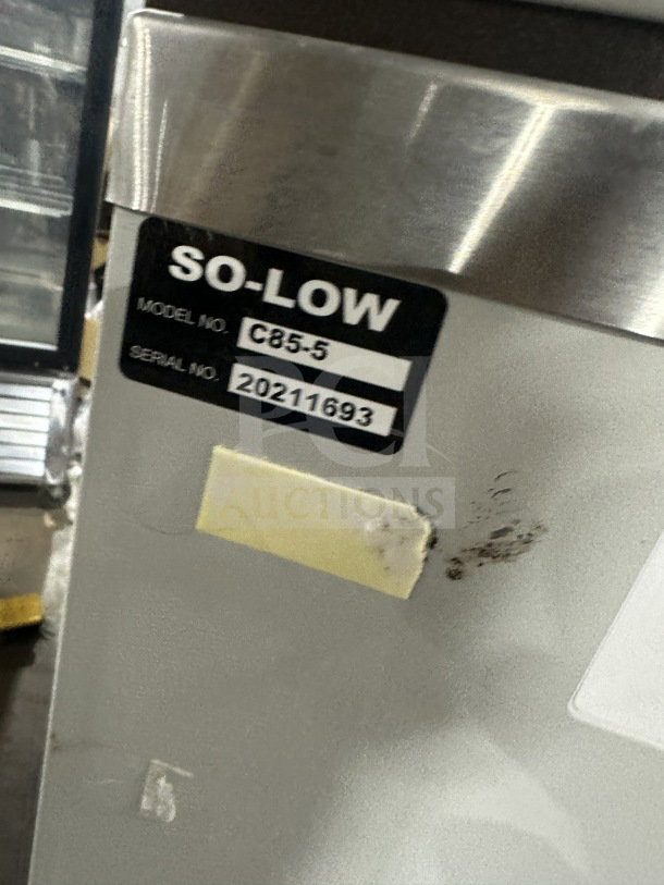 So-Low Commercial Series CA55 white freezer, Model C85-5 SN 20211693, 115V. Markings show wear on surface.