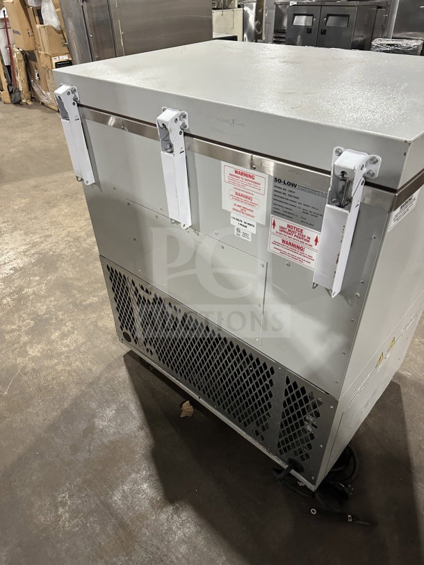 So-Low Commercial Series CA55 white low temperature chest freezer, Model SN: 202141693, in good condition, 115V, with warning labels.
