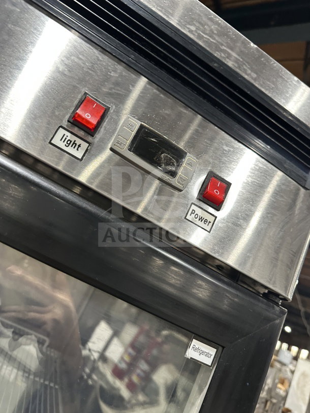 Atosa MCF8707 stainless steel commercial refrigerator, double-glass swing doors, with light and power switches visible.