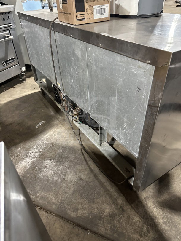 Beverage-Air WTR72AY stainless steel 3-door worktop refrigerator, 72", on casters, electric powered. Model SN: 10701701.