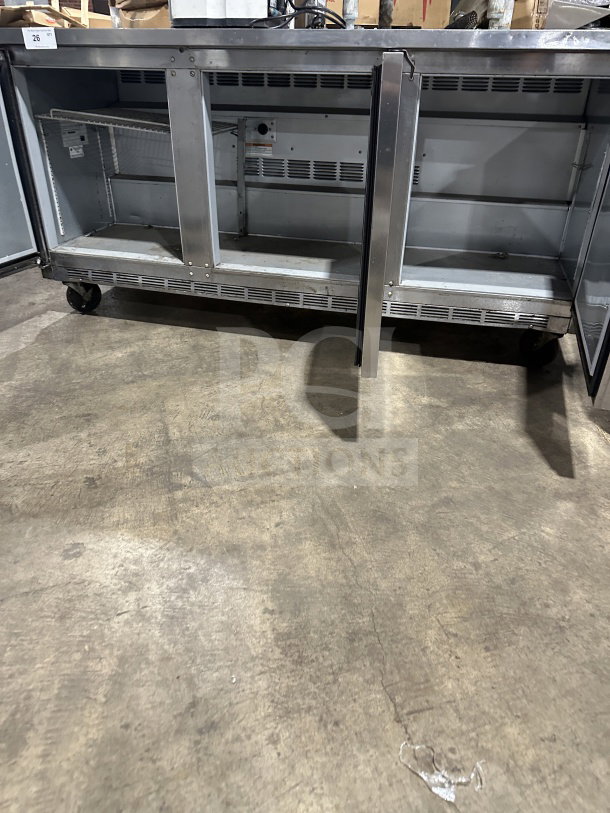 Beverage-Air WTR72AY 3-door 72" stainless steel refrigerator on casters, flat-top lowboy design, good condition.