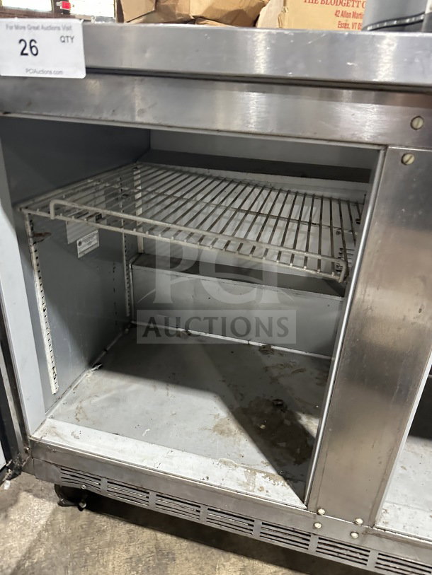 Beverage-Air WTR72AY stainless steel 3-door refrigerator, flat-top lowboy, on casters. Model SN: 10701701, 115V 1 Phase.
