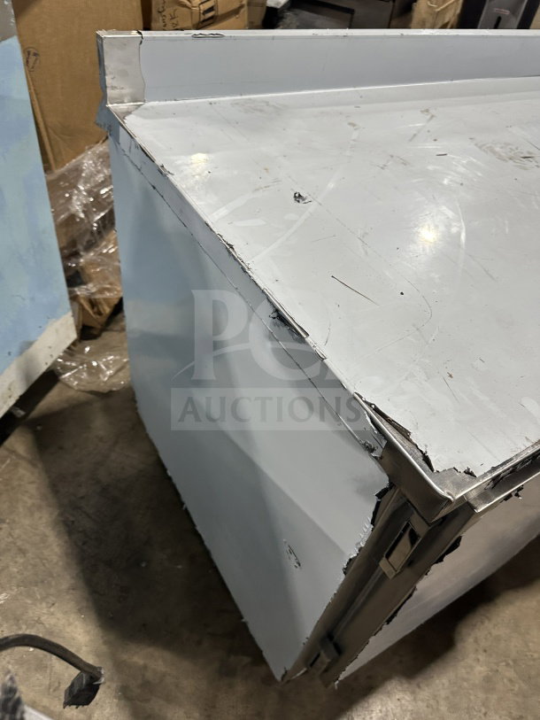 CustomCool LB93SE 3-door prep table refrigerator/freezer, stainless steel, electric, on casters. Visible surface wear.