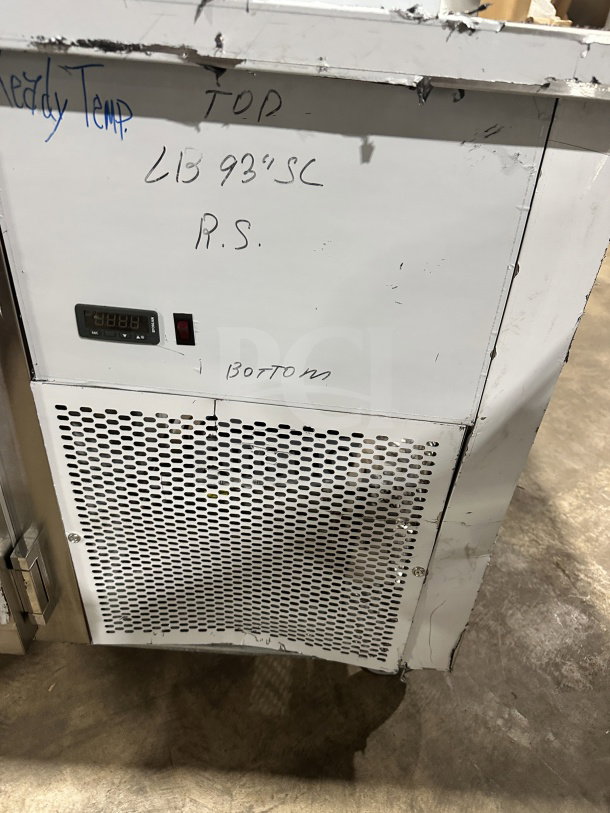 CustomCool LB93SE 3-door prep table refrigerator/freezer. Stainless steel, electric, on casters, 115V, model and serial number markings visible.