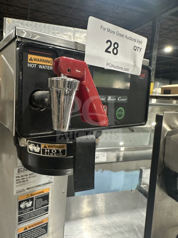 Bunn AXIOM-DV-APS coffee brewer, stainless steel, digital controls, hot water dispenser, model number on label.