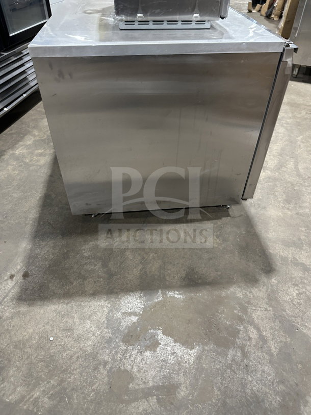 Continental CURB67 stainless steel 2-door lowboy refrigerator/freezer, electric-powered, on casters, good condition.