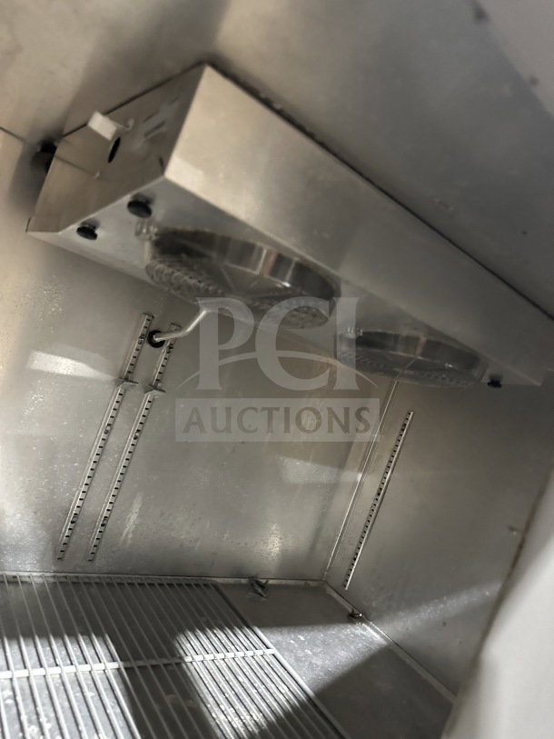 Continental 2-Door Lowboy Refrigerator/Freezer, Model CURB67, stainless steel interior, on casters, electric-powered.