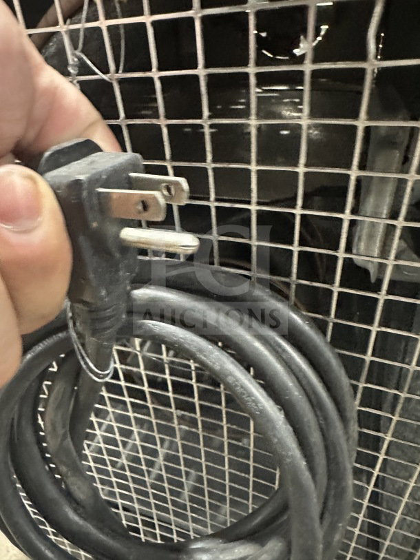 Coiled power cord of Continental CURB67 lowboy refrigerator/freezer, 115V, 1 phase, indicating electric power source.