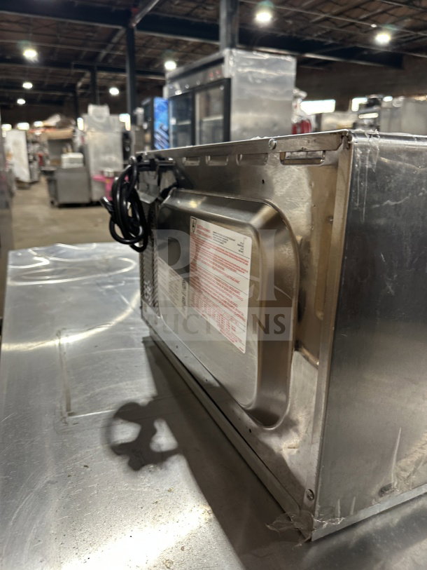 Amana RCS10DSE commercial stainless steel electric microwave oven, late model 2023, shown from the back.