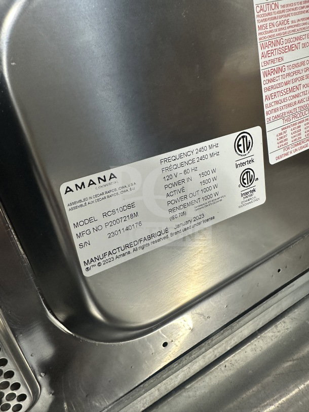 Amana 2023 commercial stainless steel countertop microwave, model RCS10DSE. SN: 2301140176. 120V, 1000W output.