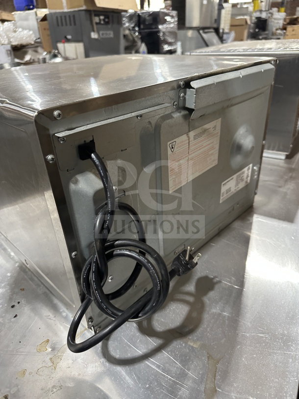 Menumaster RFS12TSW Commercial Stainless Steel Microwave Oven, 120V, digital control, rear view with power cord visible.