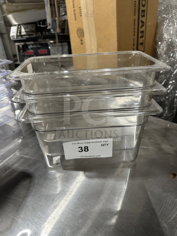 Camero Commercial Clear Polycarbonate 1/4-Size Food Pan, Model 5311, stack of three, new condition, with auction tag "38 QTY PCIAuctions.com."