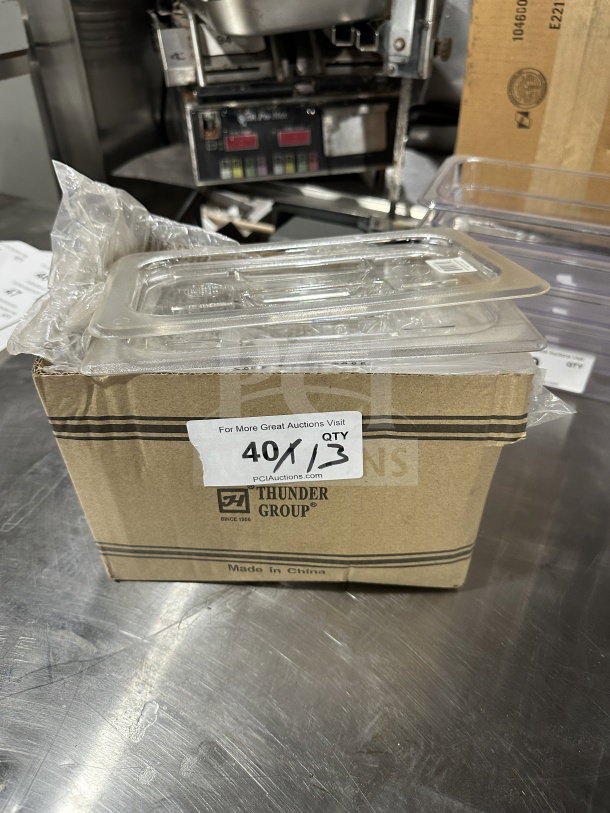 Thunder Group PLPA7130C clear polycarbonate food pan lid, 1/3-size, new in box, 13X lot available, auction label visible.