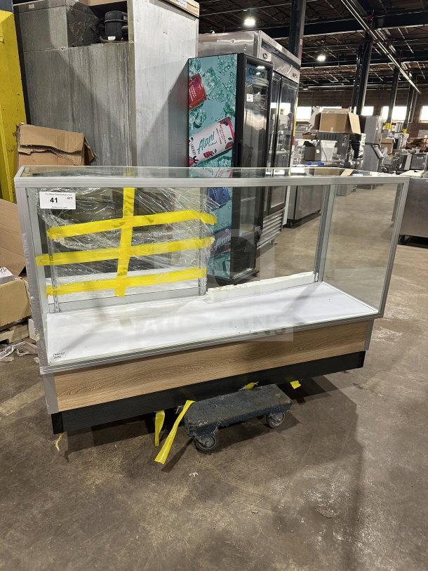 Commercial full glass dry bakery display case with wood grain trim, excellent condition. Includes yellow tape markings and number 41 tag.