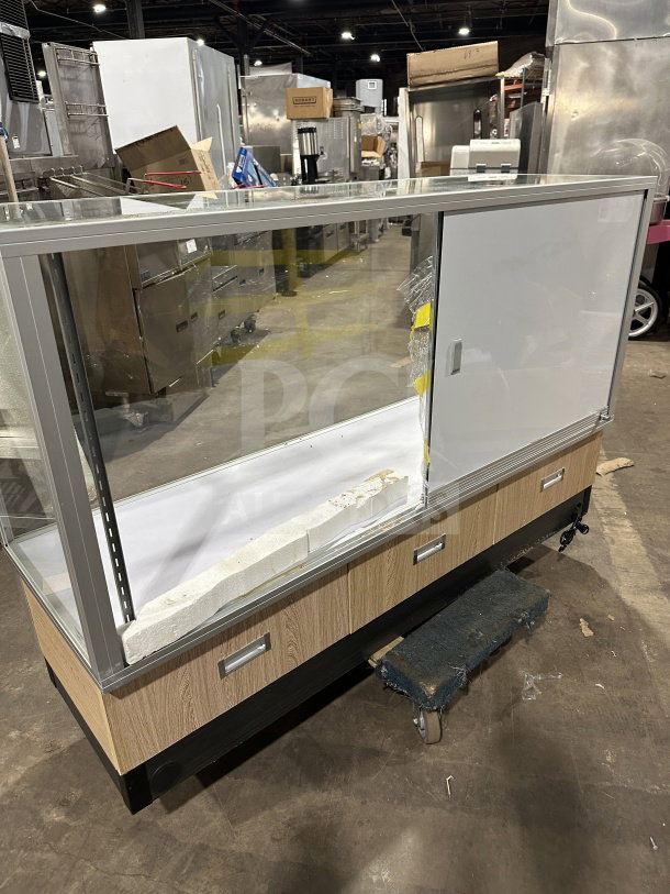 Commercial full glass dry bakery display case with wood grain trim, excellent condition, sliding doors for easy access.