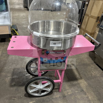 Olde Midway Spin-2000 hot-pink cotton candy machine/cart with stainless steel bowl, clear dome lid. Model: CONCOTSP2000CRT.