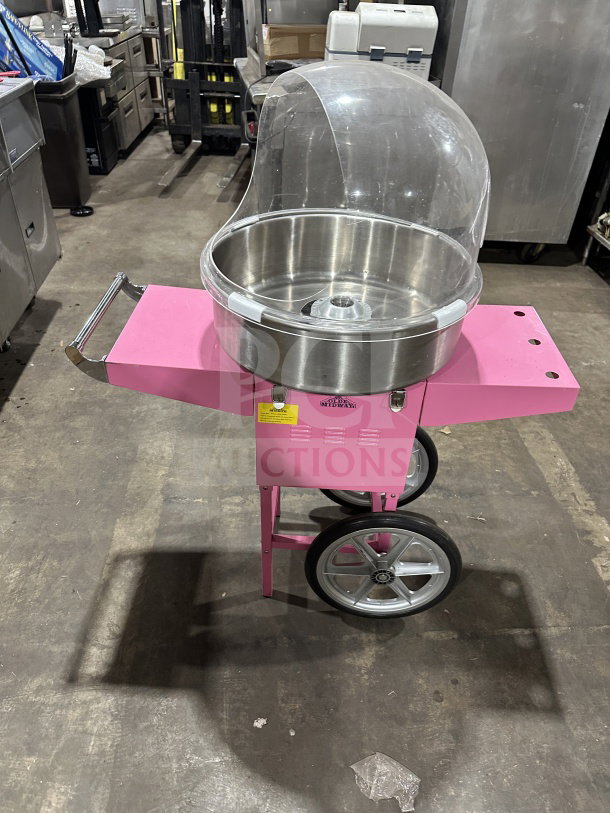 Olde Midway Spin-2000 hot-pink cotton candy machine with 20" stainless bowl, clear dome, on wheels. Model: CONCOTSP2000CRT.