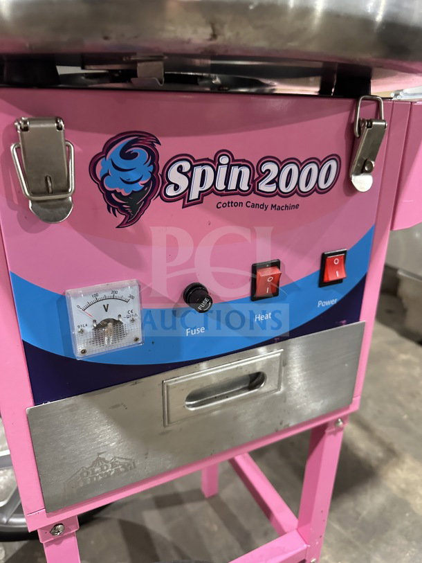 Olde Midway Spin-2000 hot-pink cotton candy machine with stainless steel bowl, clear dome lid, and cart. Model: CONCOTSP2000CRT.