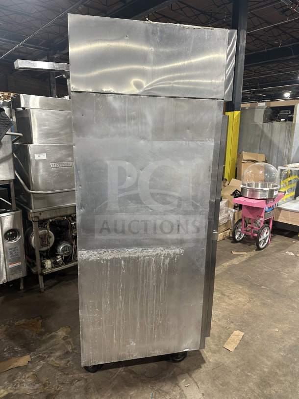 Victory RA36S7 stainless steel roll-in refrigerator, single-door, with chrome-plated wire rack, on casters. Visible wear.