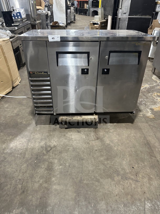 True TBB-24-48S commercial 2-door stainless steel back bar cooler, black coated wire rack, 115V, good condition.
