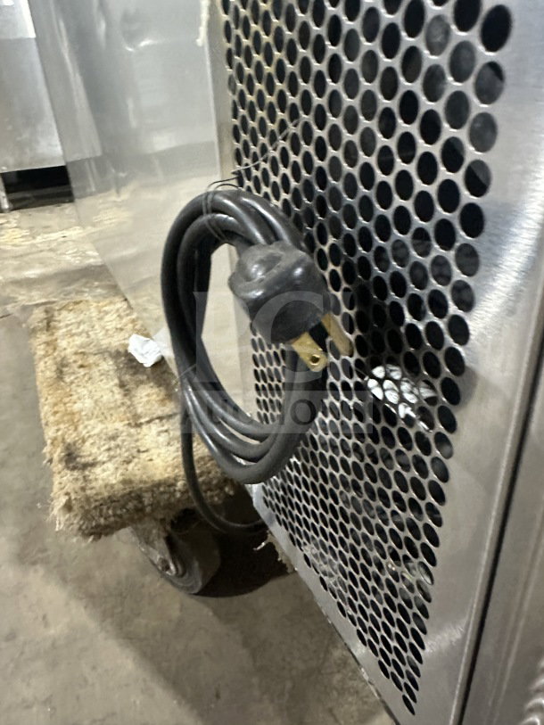 True TBB-24-48S commercial back bar cooler, stainless steel, 2-door, black-coated wired rack, 115V 1 Phase, showing power cord.