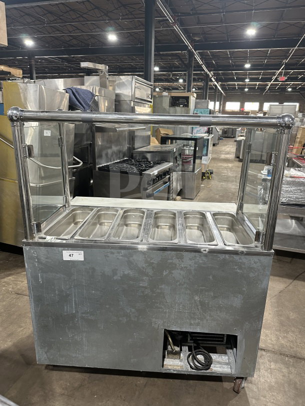 Leader Commercial Stainless Steel Mobile Refrigerated Salad Bar with glass top. Features six compartments, on casters.