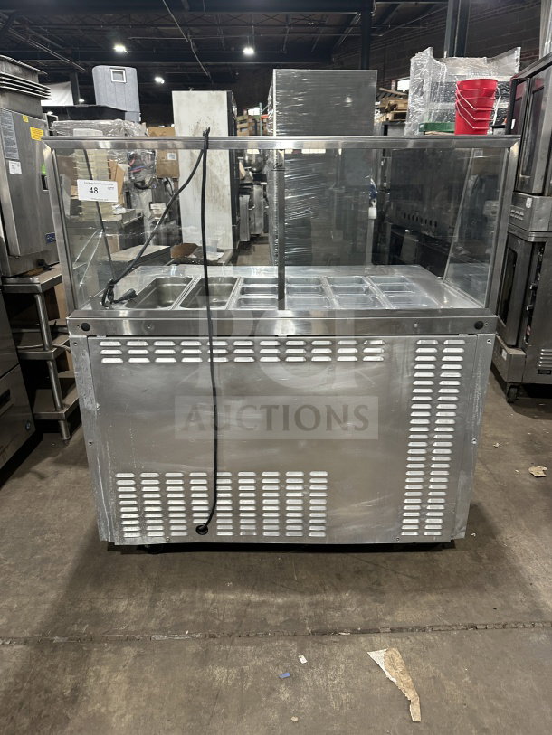 Leader commercial stainless steel refrigerated salad bar with full-glass sneeze guard, excellent condition, visible display.
