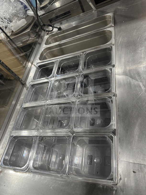 Leader stainless steel refrigerated salad bar with full-glass sneeze guard, multiple compartments, excellent condition.