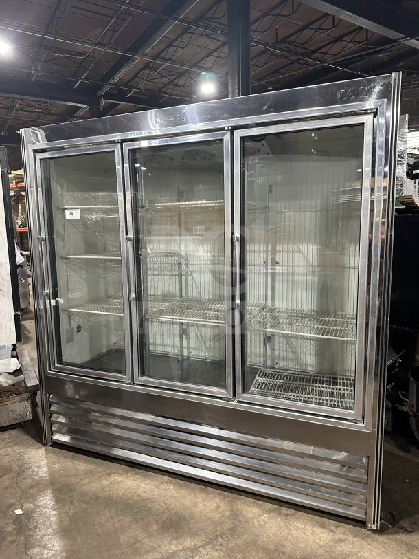 National Refrigeration 3-door reach-in freezer/refrigerator, model 14S96, with glass doors and poly coated racks, excellent condition.