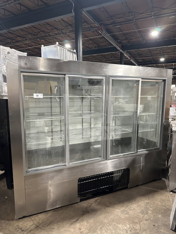 Commercial stainless steel glass sliding 4-door refrigerator/freezer, model 14-S96, with poly-coated racks, 115V, excellent condition.